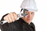 Handyman Wearing Uniform And Hardhat Stock Photo