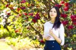 Young Beautiful Woman With Long Straight Dark Hair Posing In Spr Stock Photo