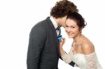 Groom Whispering Sweet Nothings Stock Photo