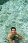 Young Man Relaxing And Smiling In Maldives (ocean Background) Stock Photo