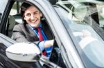 Smart Young Businessman Driving His New Car Stock Photo