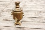 Brass Samovar On A Wooden Table Stock Photo