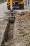 Excavator Digging Soil For Pipe Intake Stock Photo