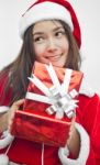 Santa Claus Hat With Red Christmas Gift Box Stock Photo