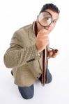 Detective And Magnifying Glass Stock Photo