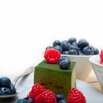 Green Tea Matcha Mousse Cake With Berries Stock Photo