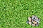 Stone On Grass Background Stock Photo