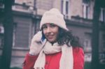 Woman With Wool Cap And Gloves With Smartphone In Hands Going Th Stock Photo