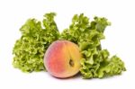 Peach With Lettuce On White Stock Photo