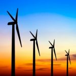 Wind Turbine Silhouette On Colorful Sunset Stock Photo