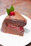 Piece Of Chocolate Cake On White Plate Stock Photo