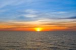 Sunset At Sea With Beautiful Clouds In The Evening And Twilight Stock Photo