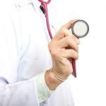 Doctor Holding Stethoscope Stock Photo