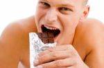 Man Eating Chocolate Stock Photo