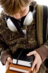 Boy Looking Books With Headphone Stock Photo