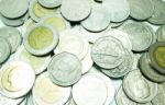 Group Of Thai Baht Coins On White Table Background Stock Photo