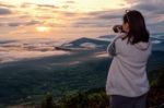 Women Are Shooting Sunrise Stock Photo