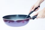 Hand With Non Stick Frying Pan On White Background Stock Photo