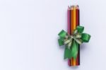 Color Pencil With Green Ribbon Stock Photo