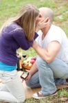 Happy Woman Kissing Her Boyfriend For The Precious Gift Stock Photo