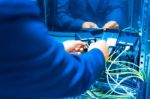 People Fix Core Switch In Network Room Stock Photo