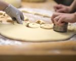 Dough Being Cut Into Donuts Stock Photo