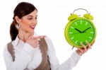 Lady Pointing At Alarm Clock Stock Photo