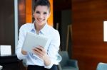 Beautiful Modern Businesswoman Holding Tablet Computer Stock Photo