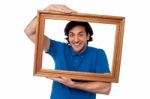 Man Holding Wooden Picture Frame Stock Photo