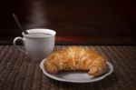 Croissant And Coffee Cup Stock Photo