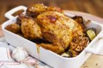 Roasted Chicken With Garlic And Potatoes Stock Photo