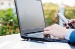 Handsome Businessman Wearing Suit And Using Modern Laptop Outdoo Stock Photo