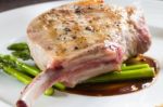 Grilled Pork Chop With Asparagus Stock Photo