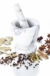 Marble Mortar And Pestle With Assorted Spices On White Backgroun Stock Photo