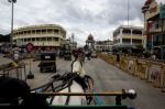 Horse Pulling A Carriage Through A City Stock Photo