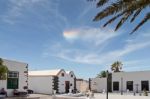 Small Rainbow Cloud Over Teguise Lanzarote Stock Photo