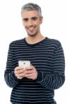 Senior Man On Smart Phone Stock Photo