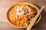 Fried Rice Noodles Topped With Pork Stock Photo