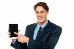 Businessman Promoting Newly Launched Tablet Stock Photo