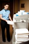 Housekeeper holding towel Stock Photo