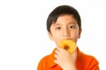 Boy Eating A Donut Stock Photo