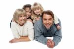 Joyful Family Of Four, Studio Shot Stock Photo