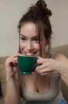 Woman With Coffee Cup On Ceramic Table And Mobile Phone Stock Photo