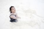 Girl Playing On Sand Beach Stock Photo