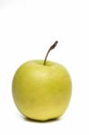 Single Fresh And Healthy Yellow Apple Stock Photo