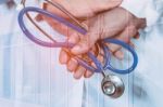 Doctor Holds The Device For A Fever Stock Photo