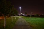 Night Public Park In The City With Houses Near Stock Photo