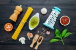 The  Pasta On Black Wooden Background. Yellow Italian Pasta With Stock Photo