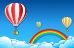 Balloons Flying Over Rainbow Stock Photo