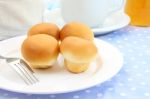 Some Buns White Plate On Morning Table Stock Photo